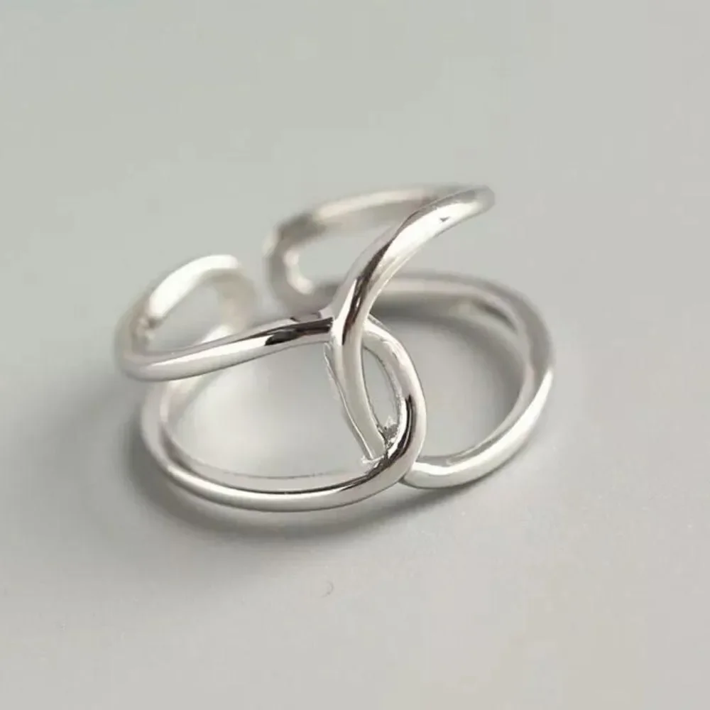 The Loop Ring in 925 silver adjustable sizing.